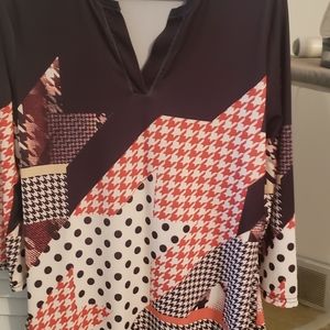 3/4 length sleeves, 30 inches from shoulder to hem. 95% polyester 5% stretch.